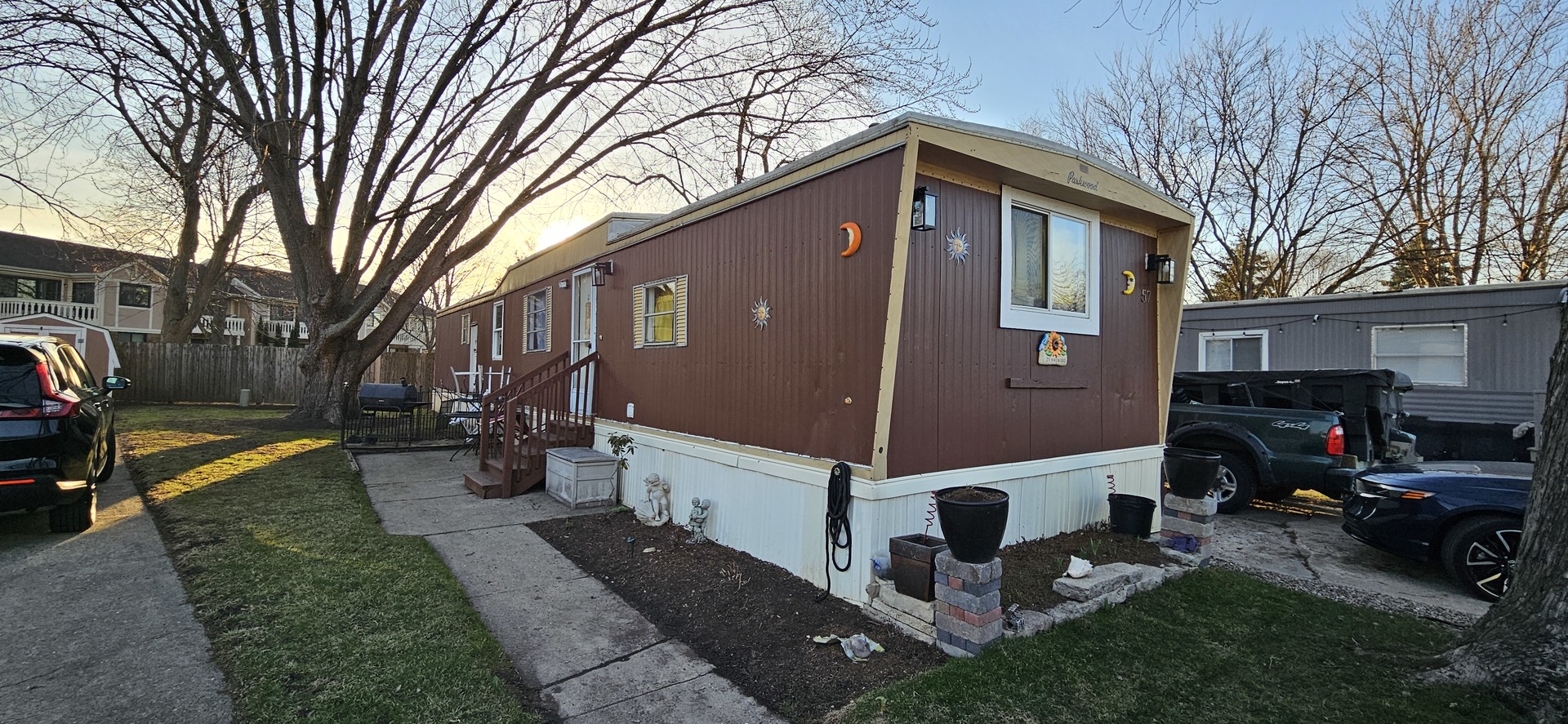 57 Curricle Road Wheeling, IL 60090 - Photo 2 of 22 a front view of a house with a yard
