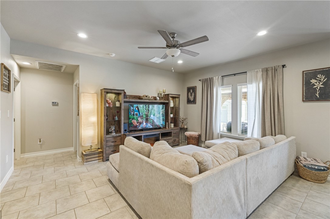 103 Donegal Street Sinton, TX 78387 - Photo 6 of 29 a living room with furniture and a flat screen tv
