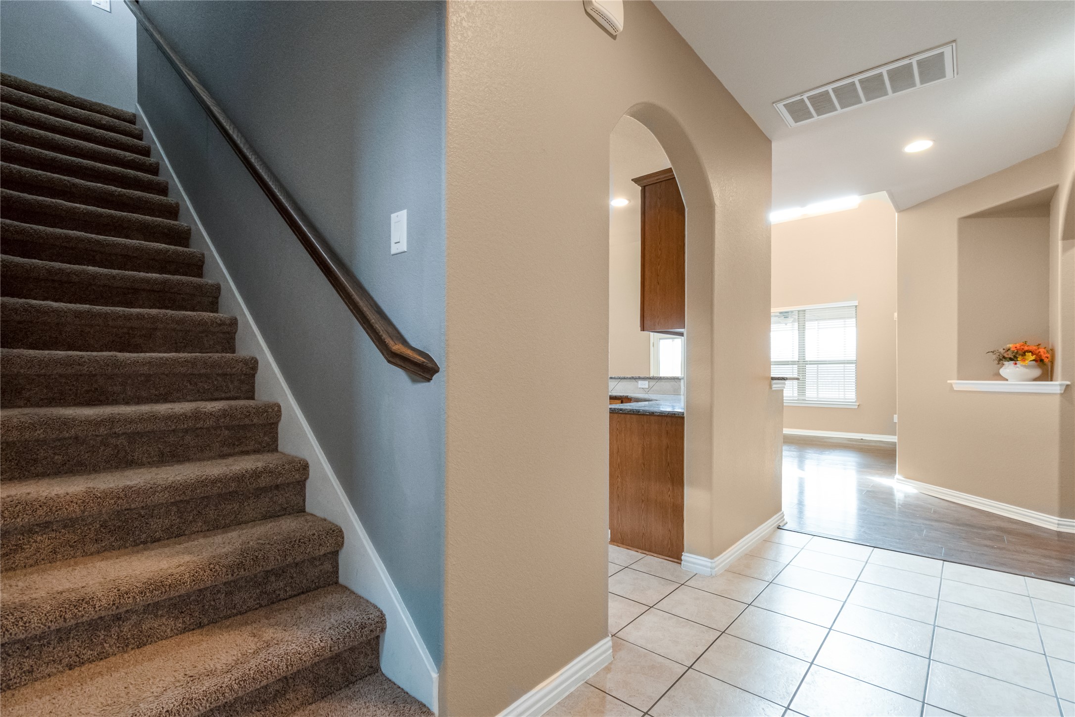 3413 Grail Hollows Road Pflugerville, TX 78660 - Photo 22 of 36 Staircase with tile patterned floors and arched walkways