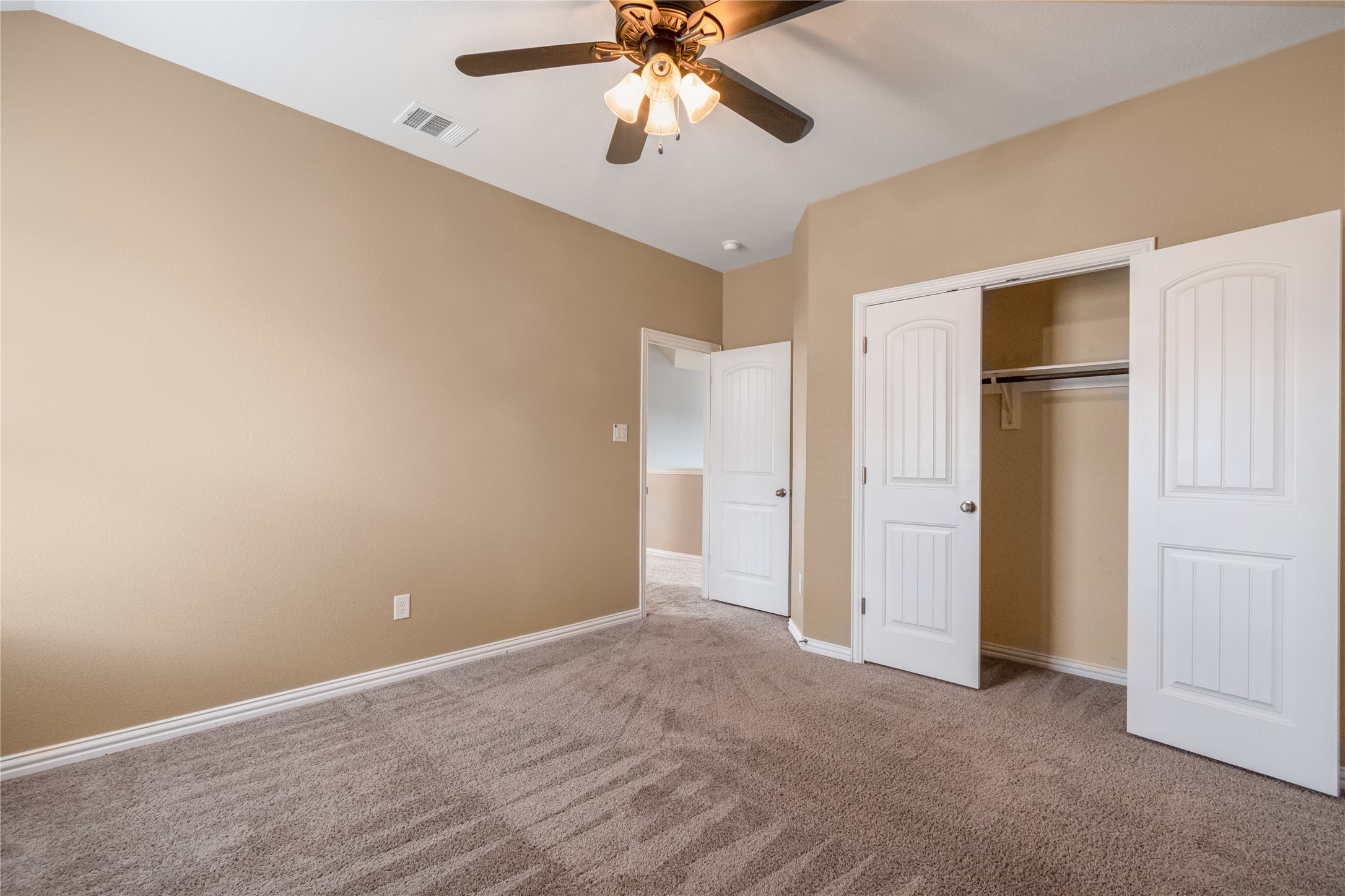 3413 Grail Hollows Road Pflugerville, TX 78660 - Photo 29 of 36 Unfurnished bedroom with carpet floors, a closet, and a ceiling fan