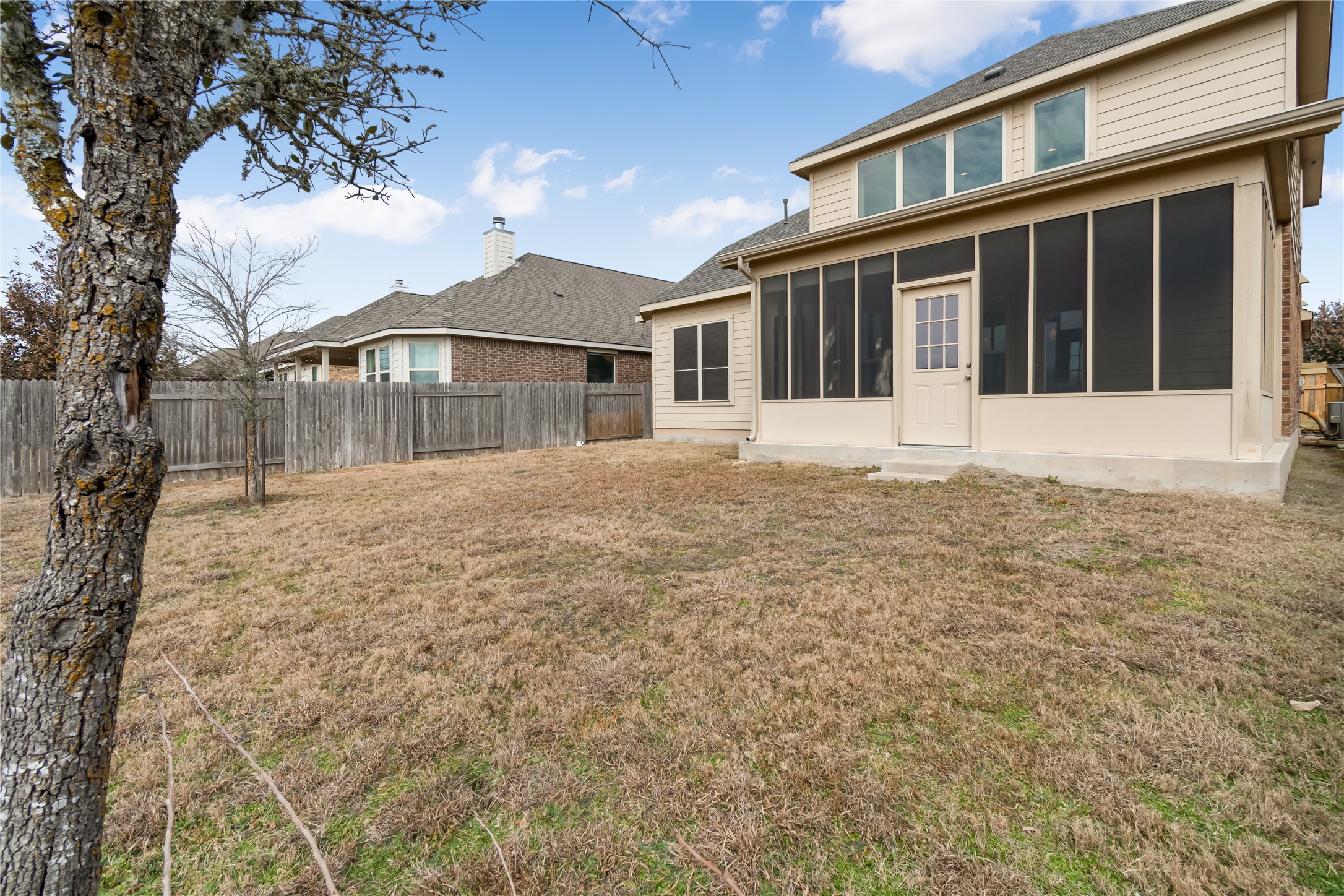 3413 Grail Hollows Road Pflugerville, TX 78660 - Photo 33 of 36 Back of property with a fenced backyard and a sunroom