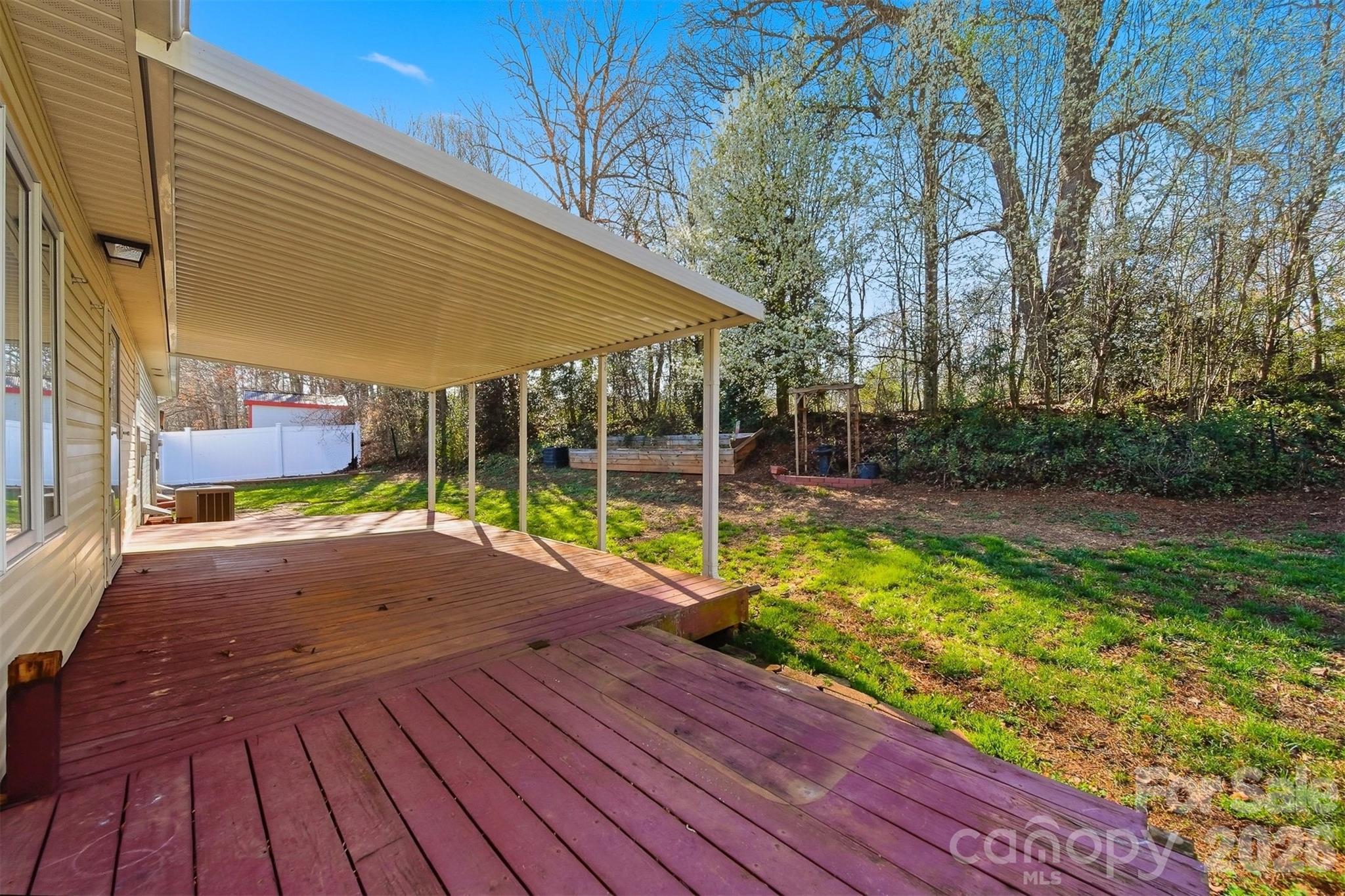 4771 Petra Mill Road Granite Falls, NC 28630 - Photo 8 of 46 a view of backyard with swimming pool and outdoor seating