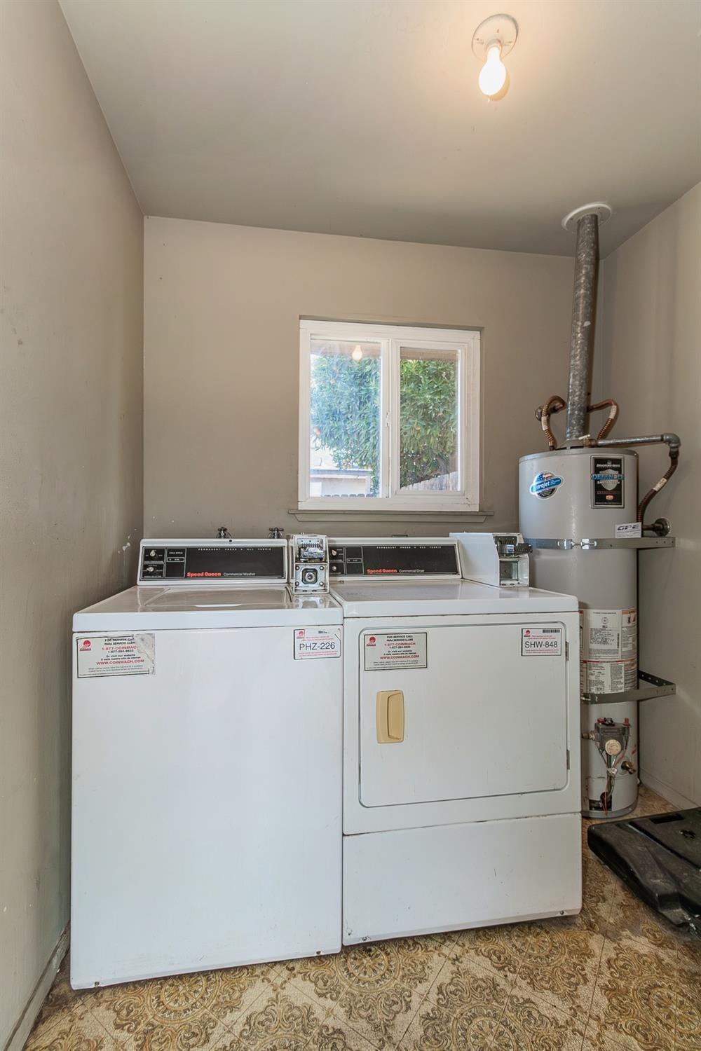 1306 13th Street Reedley, CA 93654 - Photo 14 of 14 a view of a storage & utility room with washer and dryer