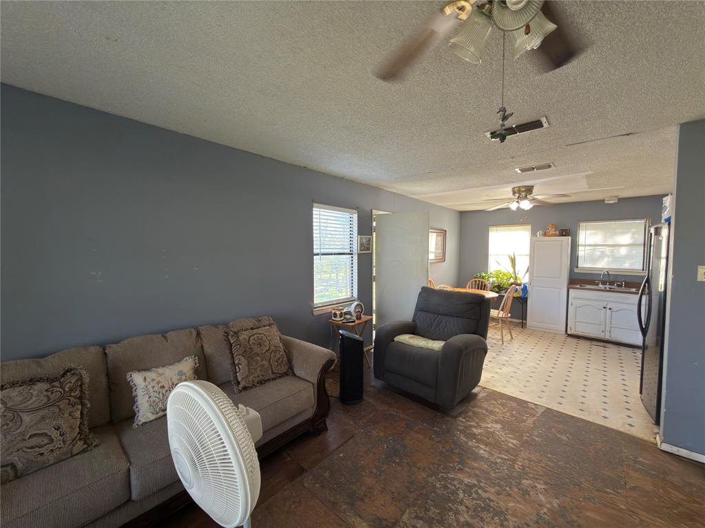 12776 Valverde Loop Terrell, TX 75161 - Photo 7 of 36 a living room with furniture and a window