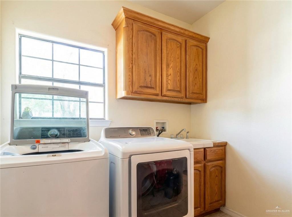 4706 North Trosper Road Mission, TX 78573 - Photo 5 of 12 a utility room with dryer and washer