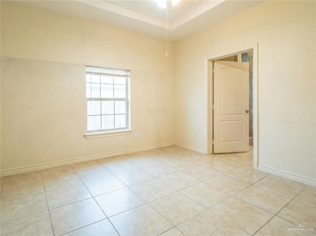 4706 North Trosper Road Mission, TX 78573 - Photo 6 of 12 an empty room with windows and closet