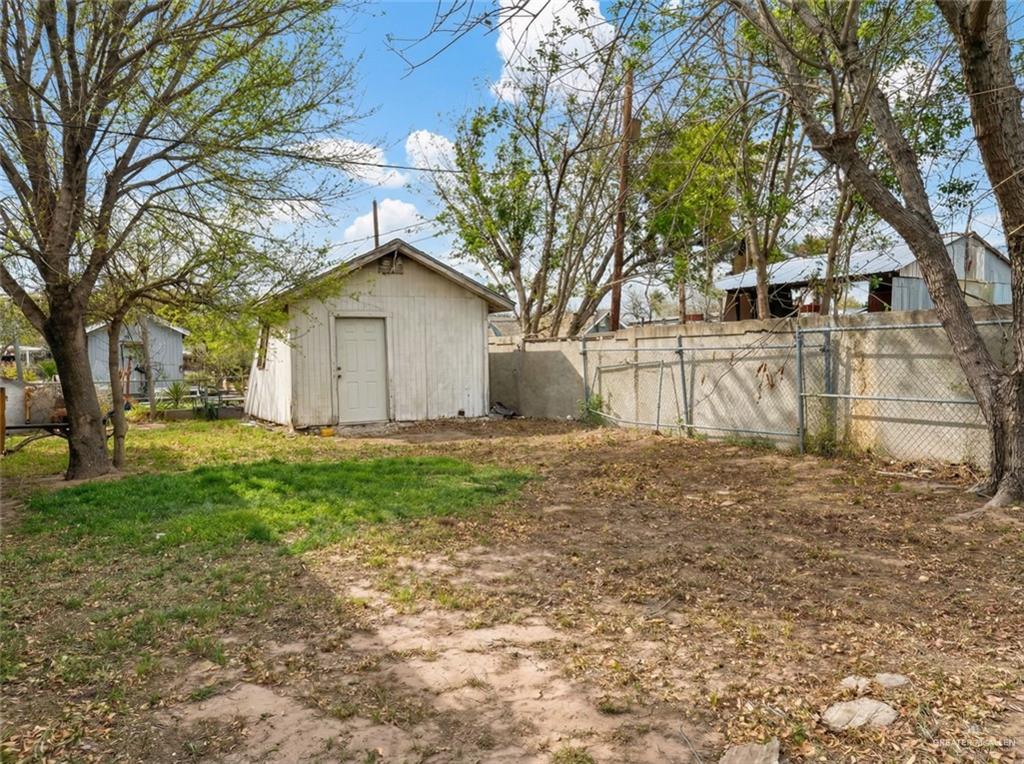 4706 North Trosper Road Mission, TX 78573 - Photo 10 of 12 a white house that has a tree in front of it