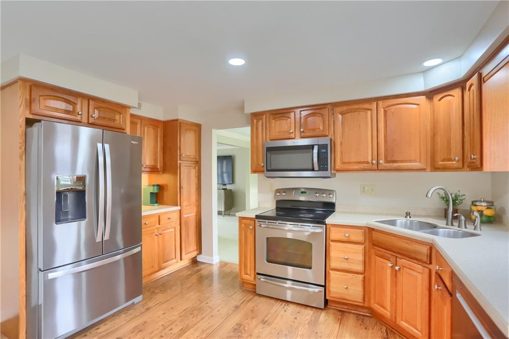 1702 Guyton Road Allison Park, PA 15101 - Photo 11 of 40 a kitchen with stainless steel appliances a refrigerator sink and microwave