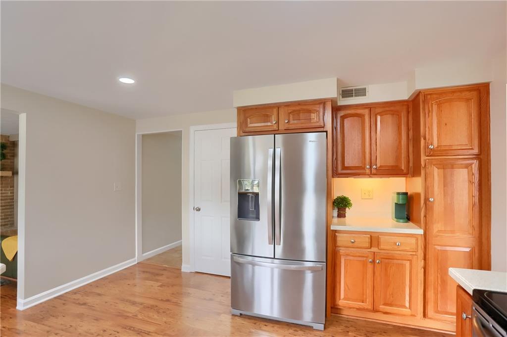 1702 Guyton Road Allison Park, PA 15101 - Photo 13 of 40 a kitchen with stainless steel appliances granite countertop a refrigerator and a stove top oven