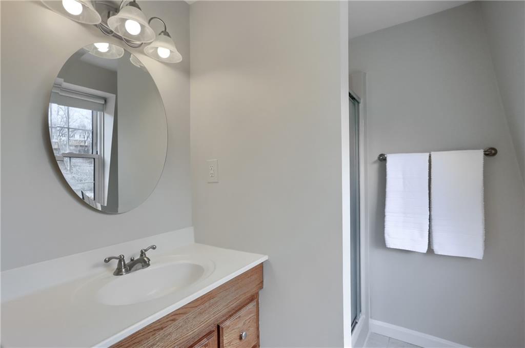1702 Guyton Road Allison Park, PA 15101 - Photo 24 of 40 a bathroom with a sink and a mirror