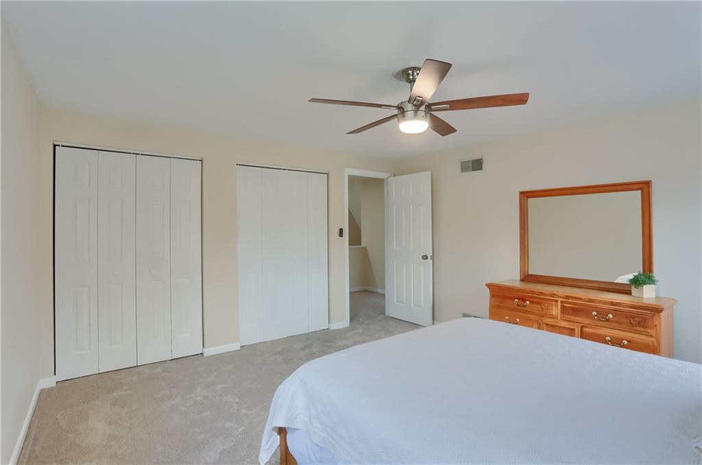 1702 Guyton Road Allison Park, PA 15101 - Photo 28 of 40 a bedroom with a bed and a chandelier