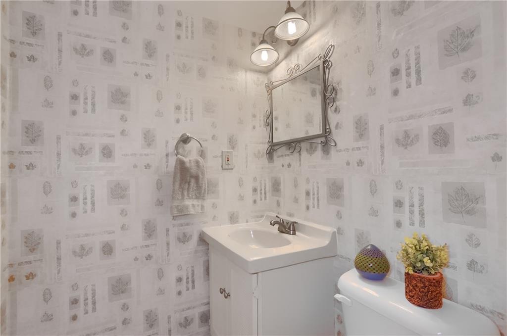 1702 Guyton Road Allison Park, PA 15101 - Photo 35 of 40 a bathroom with a sink a toilet and mirror