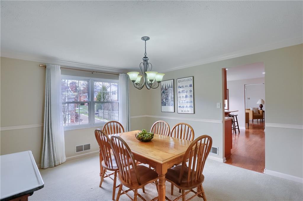 1702 Guyton Road Allison Park, PA 15101 - Photo 10 of 40 a view of a dining room with furniture window and wooden floor