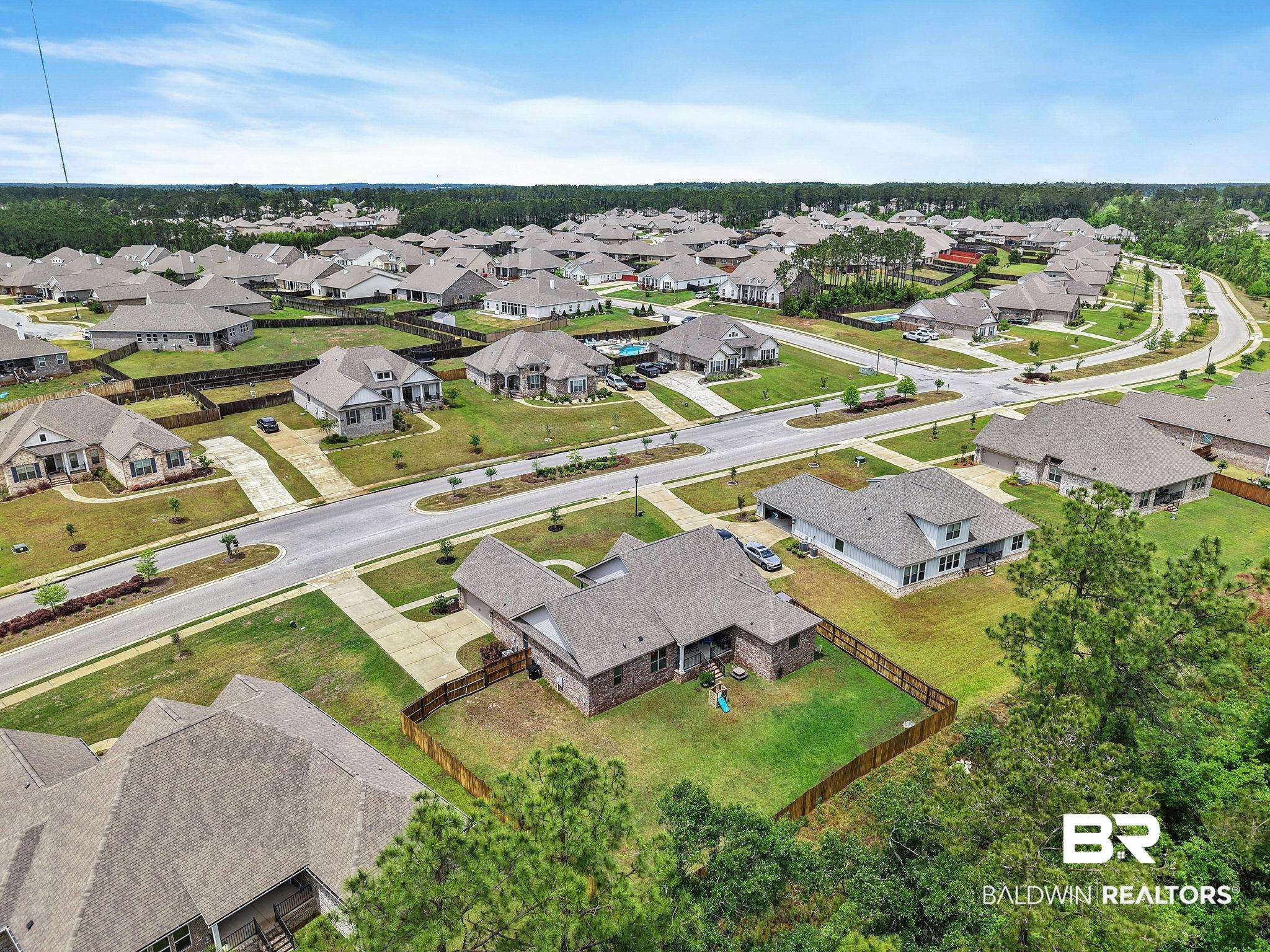 13233 Ibis Boulevard Daphne, AL 36527 - Photo 74 of 100 Aerial perspective of a developed residential neighborhood with numerous single-story homes featuring shingle roofs