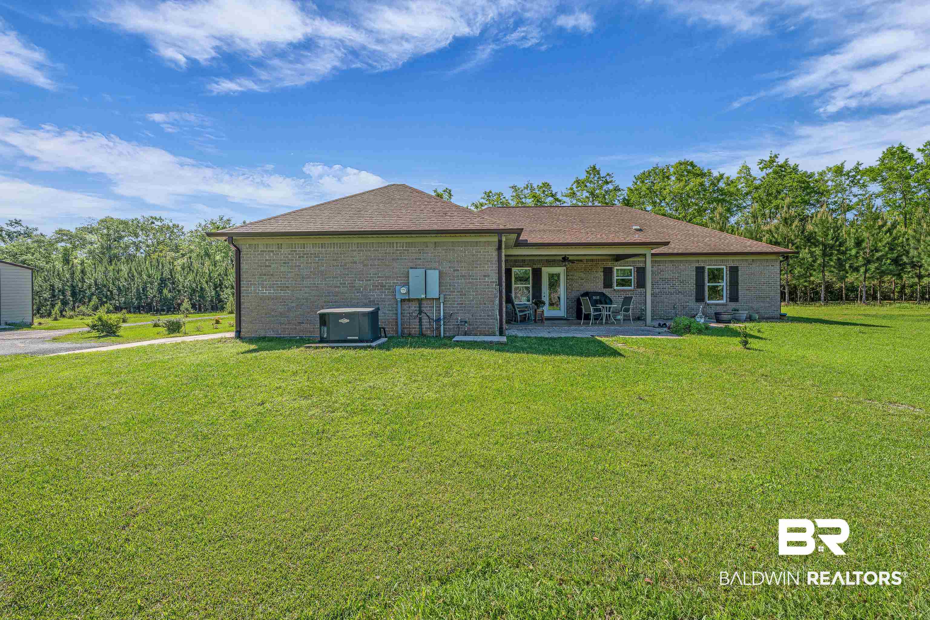 18255 Cactus Court Elberta, AL 36530 - Photo 35 of 53 Back of property featuring a lawn, a patio, brick siding, and a shingled roof