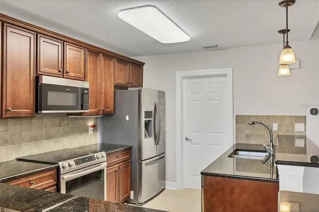 a view of a city from a chairs and table in the balcony
