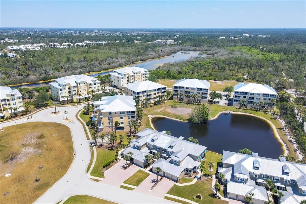 10720 Lemon Creek Loop, Unit 103 Englewood, FL 34224 - Photo 22 of 57 an aerial view of a house with outdoor space