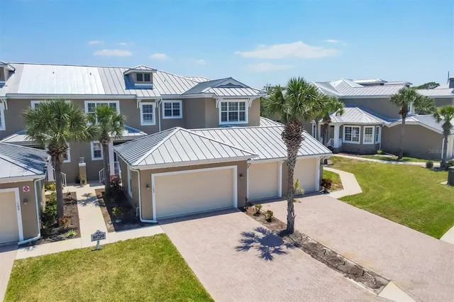a bedroom with a bed and a potted plant