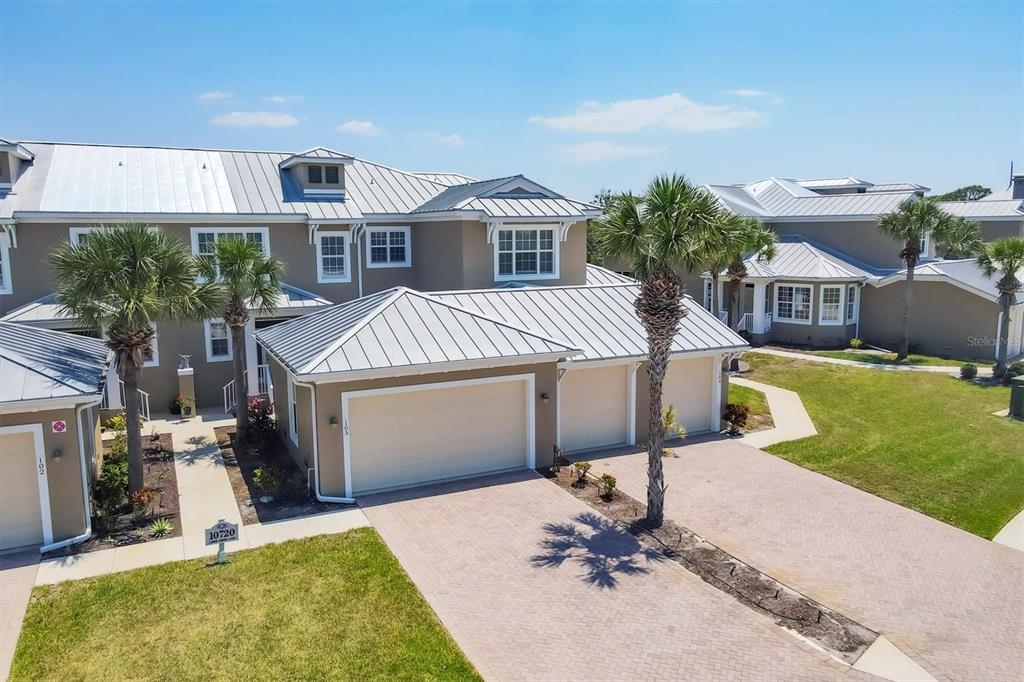 10720 Lemon Creek Loop, Unit 103 Englewood, FL 34224 - Photo 24 of 57 a view of a house with a yard