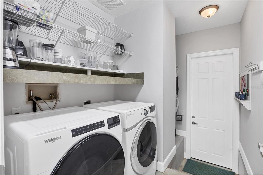 10720 Lemon Creek Loop, Unit 103 Englewood, FL 34224 - Photo 25 of 57 a utility room with dryer and washer