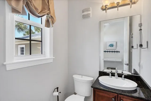 a bedroom with two beds and a large window