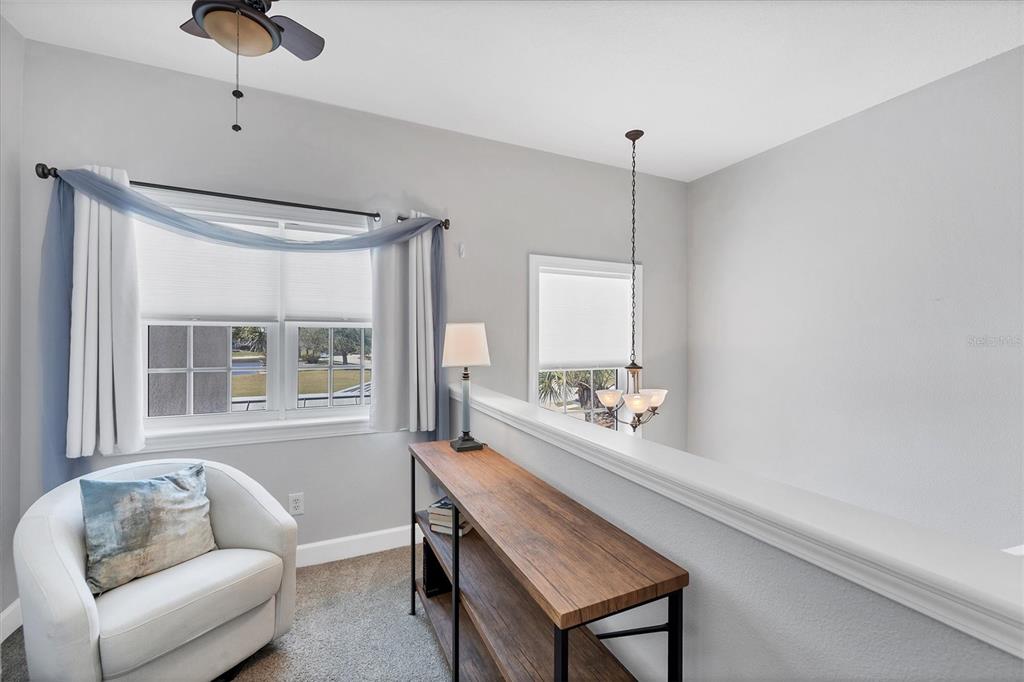 10720 Lemon Creek Loop, Unit 103 Englewood, FL 34224 - Photo 28 of 57 a room with a couch and a window