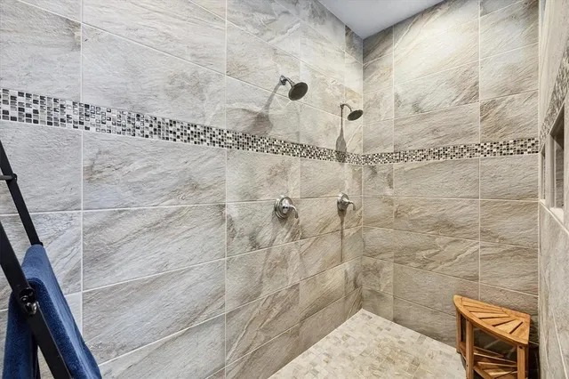 a bathroom with a toilet sink and a mirror