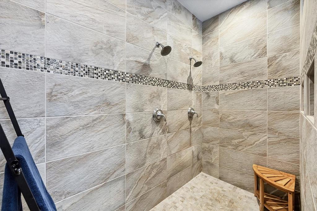 10720 Lemon Creek Loop, Unit 103 Englewood, FL 34224 - Photo 32 of 57 a bathroom with a shower