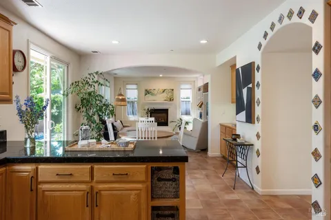 a dining room with furniture and a fireplace