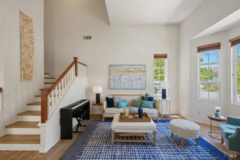 a living room with furniture and a rug