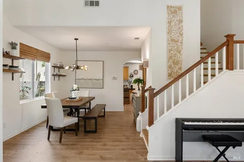 a view of a dining room with furniture window and wooden floor