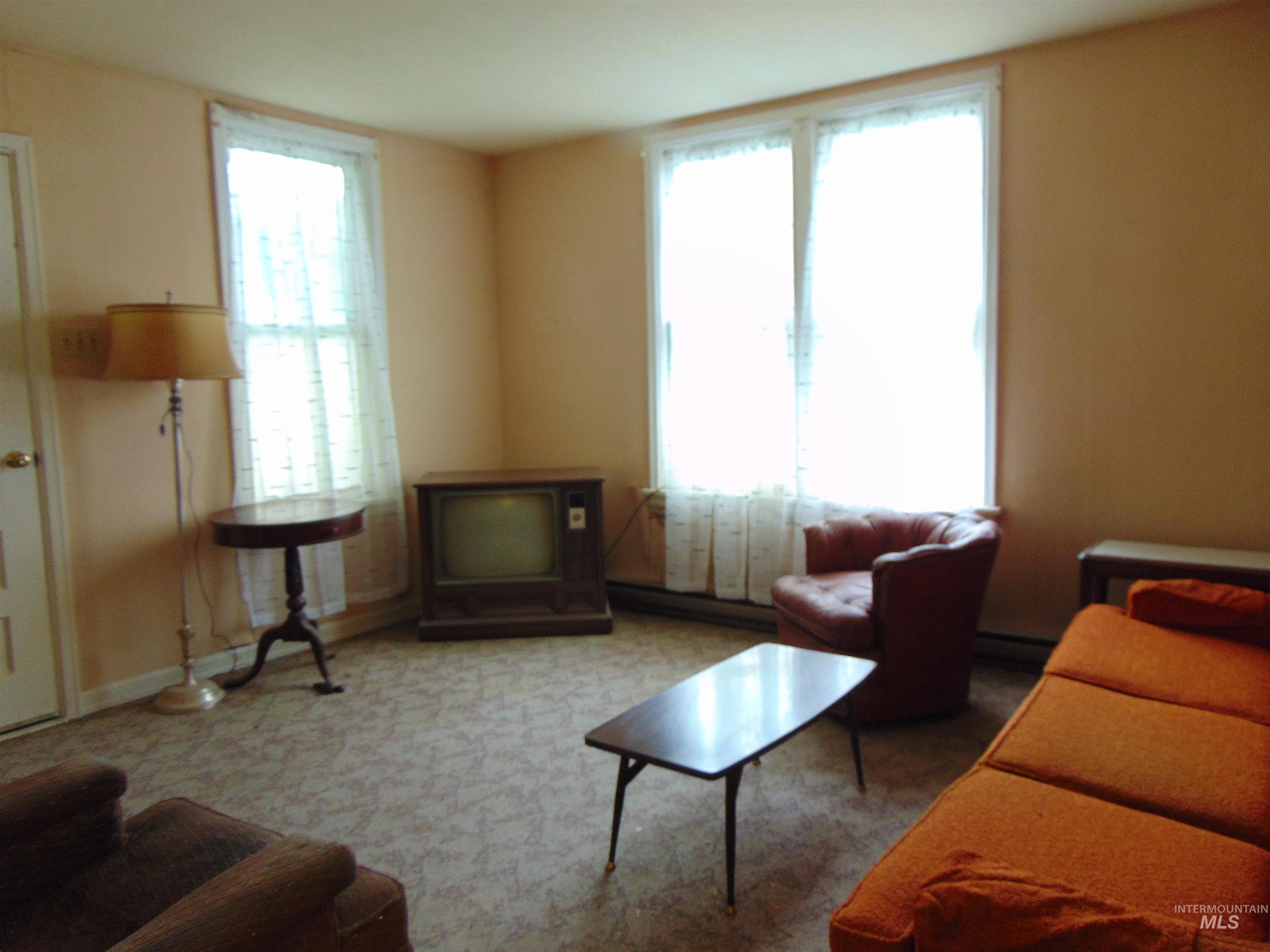 233 Glenn Street South Vale, OR 97918 - Photo 2 of 10 Living room featuring a baseboard radiator and baseboard heating