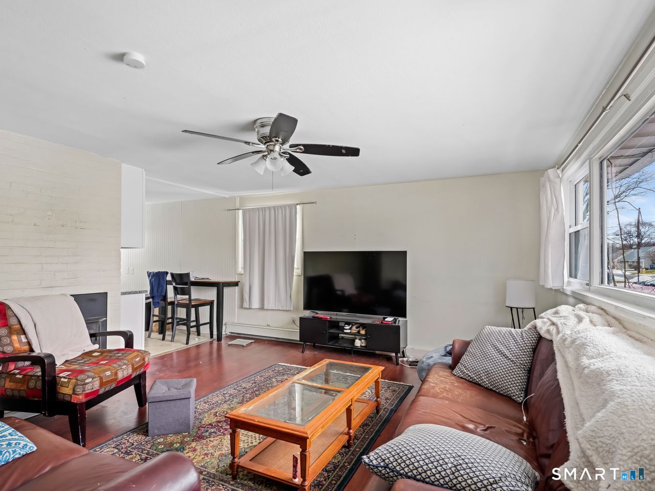 69 Seaver Circle Bridgeport, CT 06606 - Photo 11 of 29 a living room with furniture and a flat screen tv