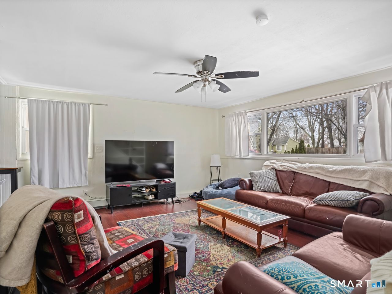 69 Seaver Circle Bridgeport, CT 06606 - Photo 12 of 29 a living room with furniture and a flat screen tv
