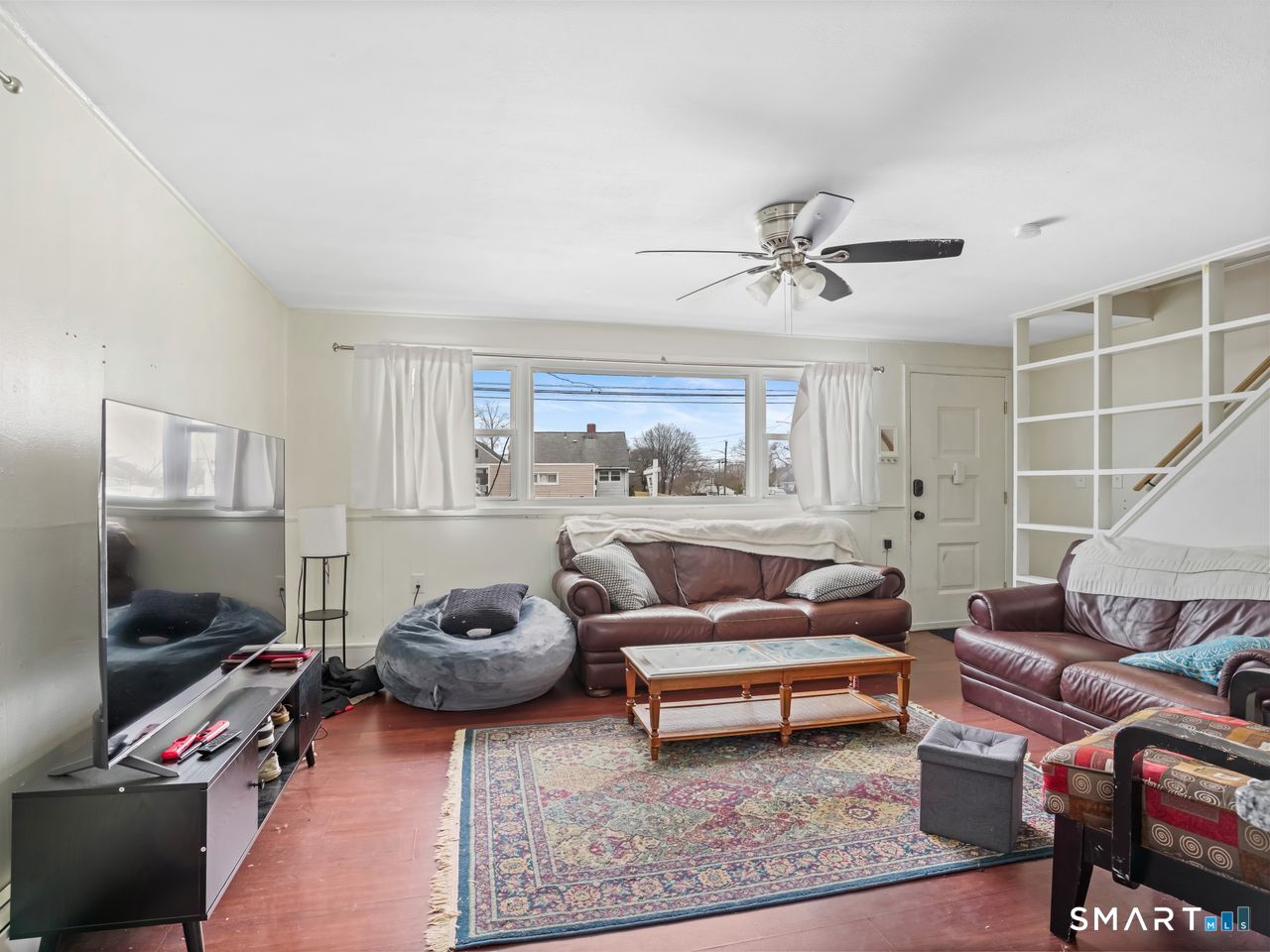 69 Seaver Circle Bridgeport, CT 06606 - Photo 13 of 29 a living room with furniture and a flat screen tv