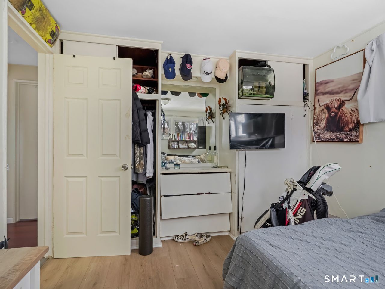 69 Seaver Circle Bridgeport, CT 06606 - Photo 20 of 29 a view of a bedroom with bed and workspace