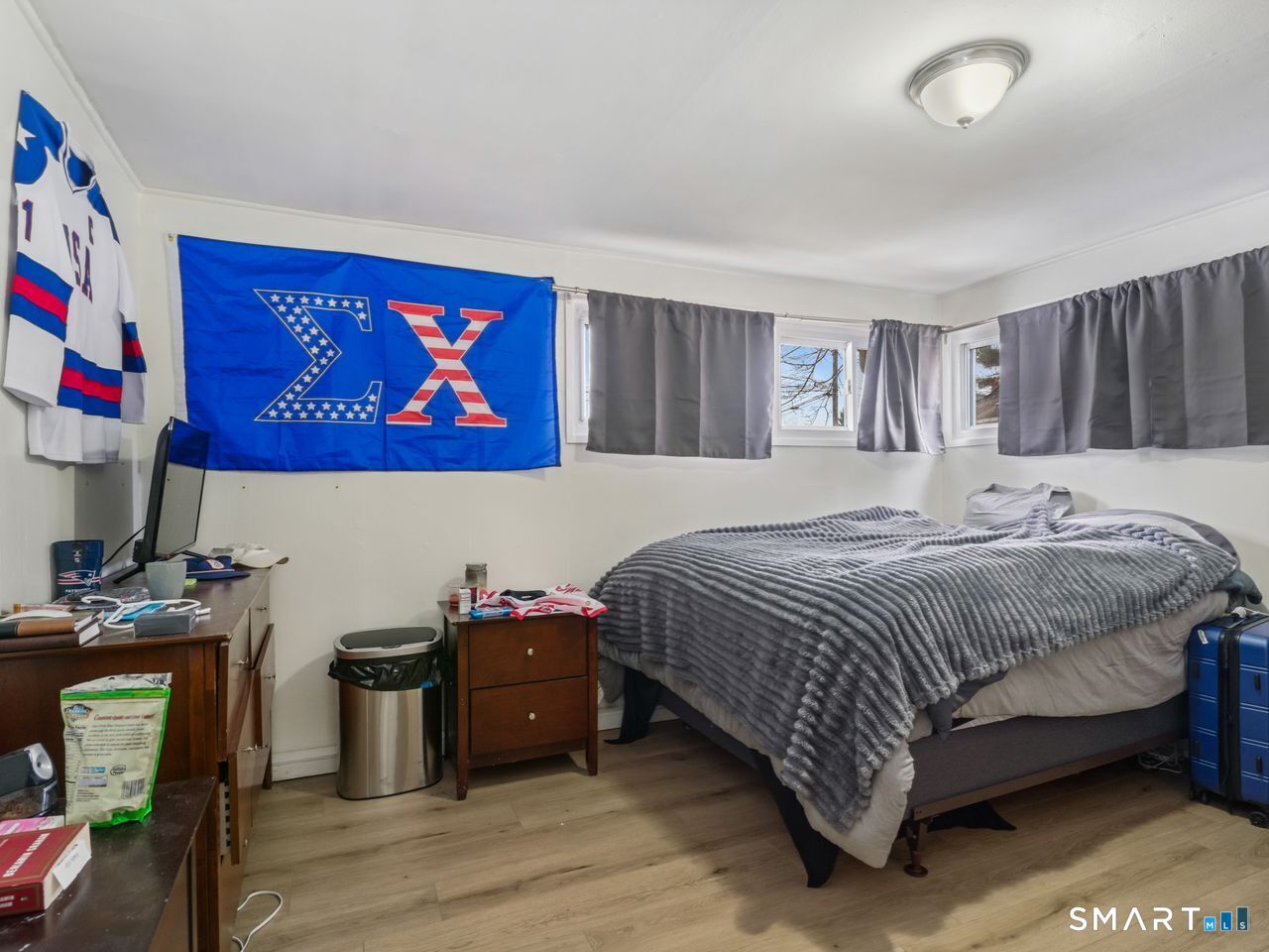 69 Seaver Circle Bridgeport, CT 06606 - Photo 21 of 29 a bedroom with a bed and a flat screen tv