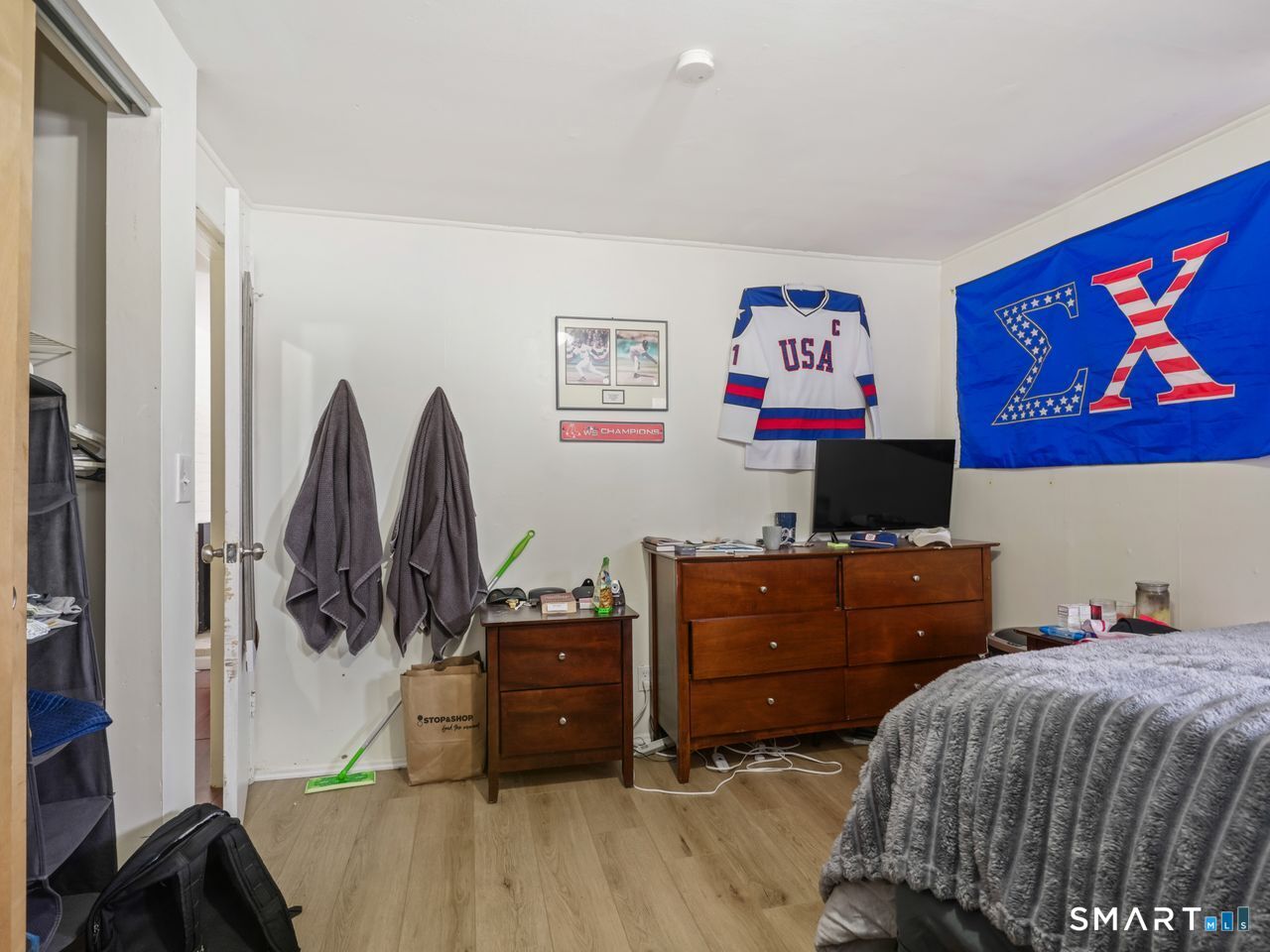 69 Seaver Circle Bridgeport, CT 06606 - Photo 23 of 29 a bedroom with a bed and a flat screen tv
