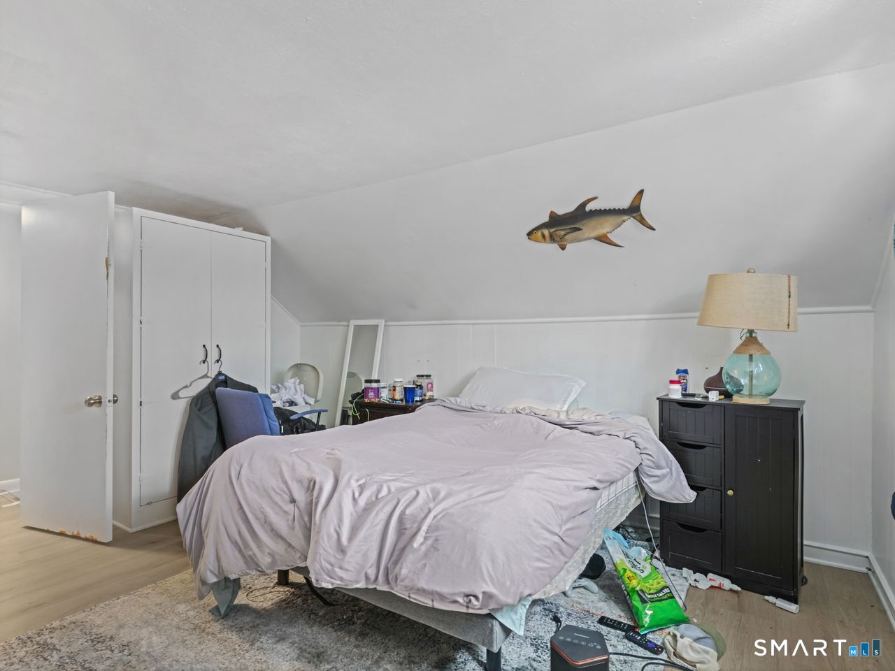 69 Seaver Circle Bridgeport, CT 06606 - Photo 26 of 29 a bedroom with a bed and a window