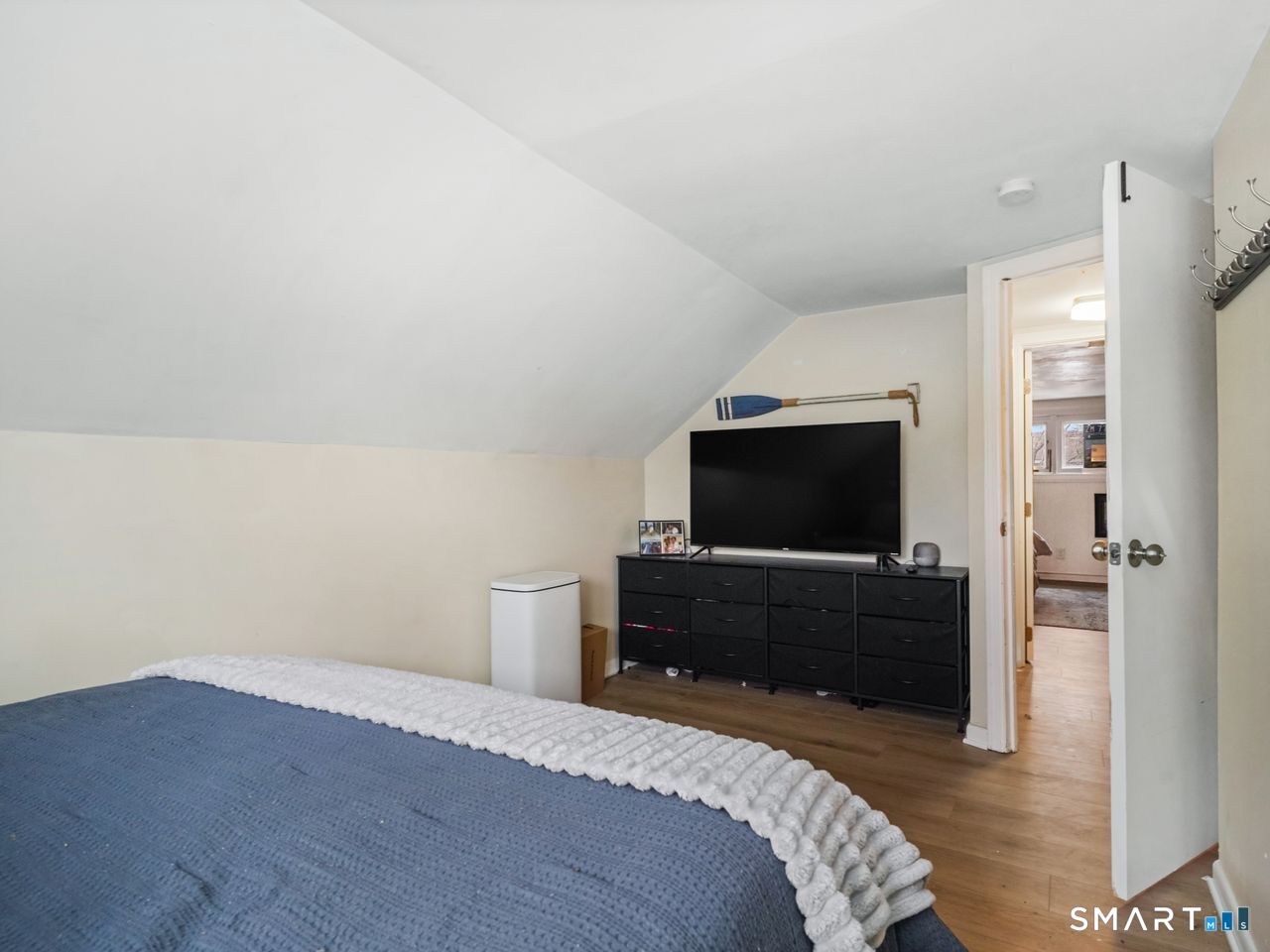 69 Seaver Circle Bridgeport, CT 06606 - Photo 29 of 29 a bedroom with a bed and a flat screen tv