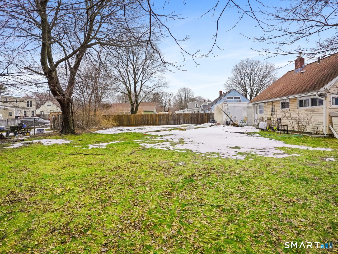 69 Seaver Circle Bridgeport, CT 06606 - Photo 4 of 29 a view of a yard with a house in the background