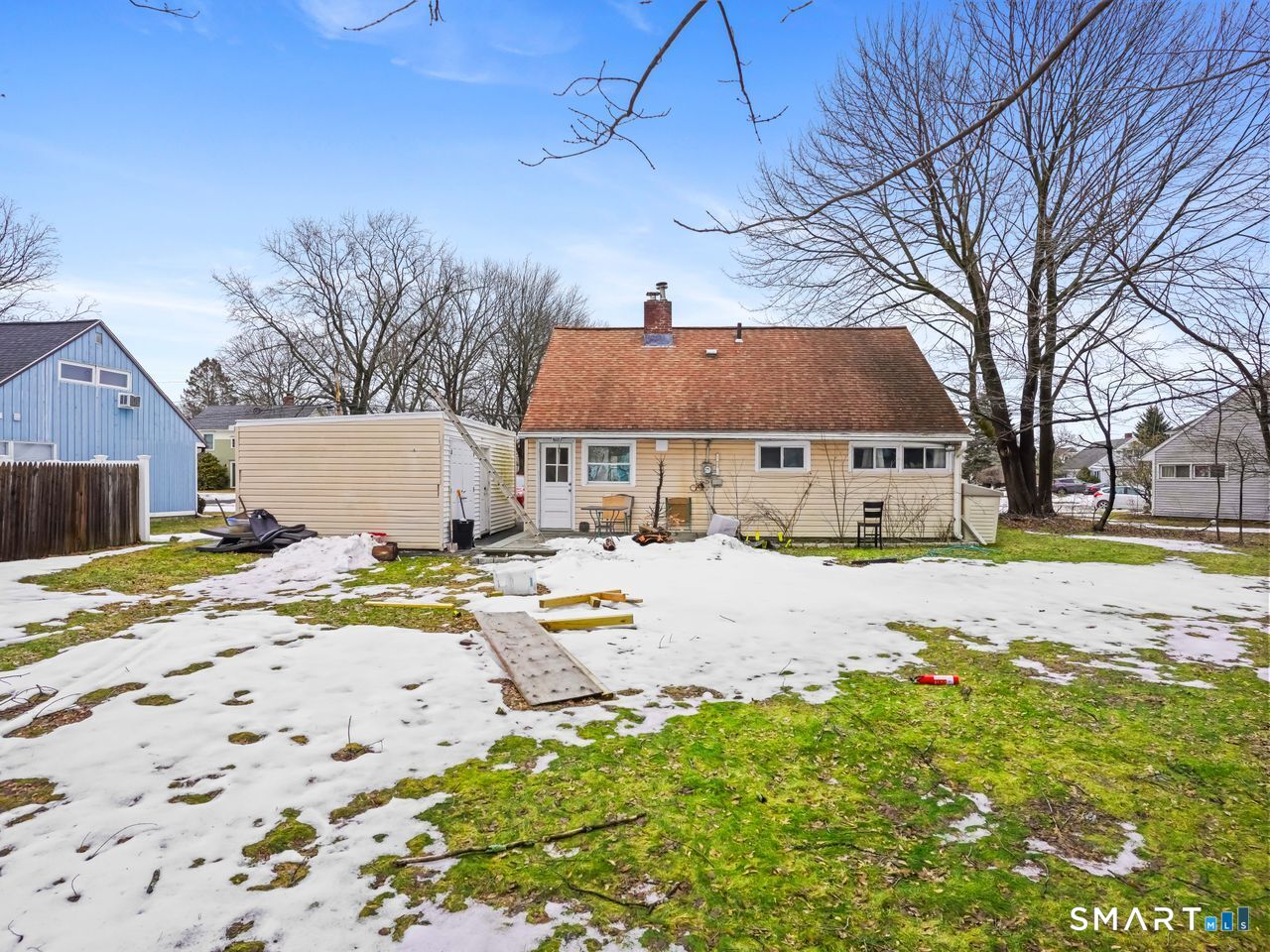 69 Seaver Circle Bridgeport, CT 06606 - Photo 6 of 29 a view of the house with snow on the road
