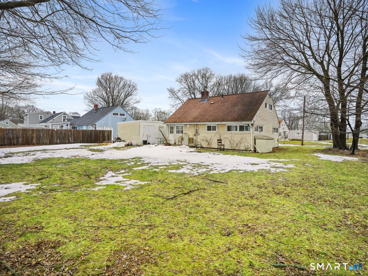 69 Seaver Circle Bridgeport, CT 06606 - Photo 7 of 29 a large pool that has lawn chairs under an umbrella
