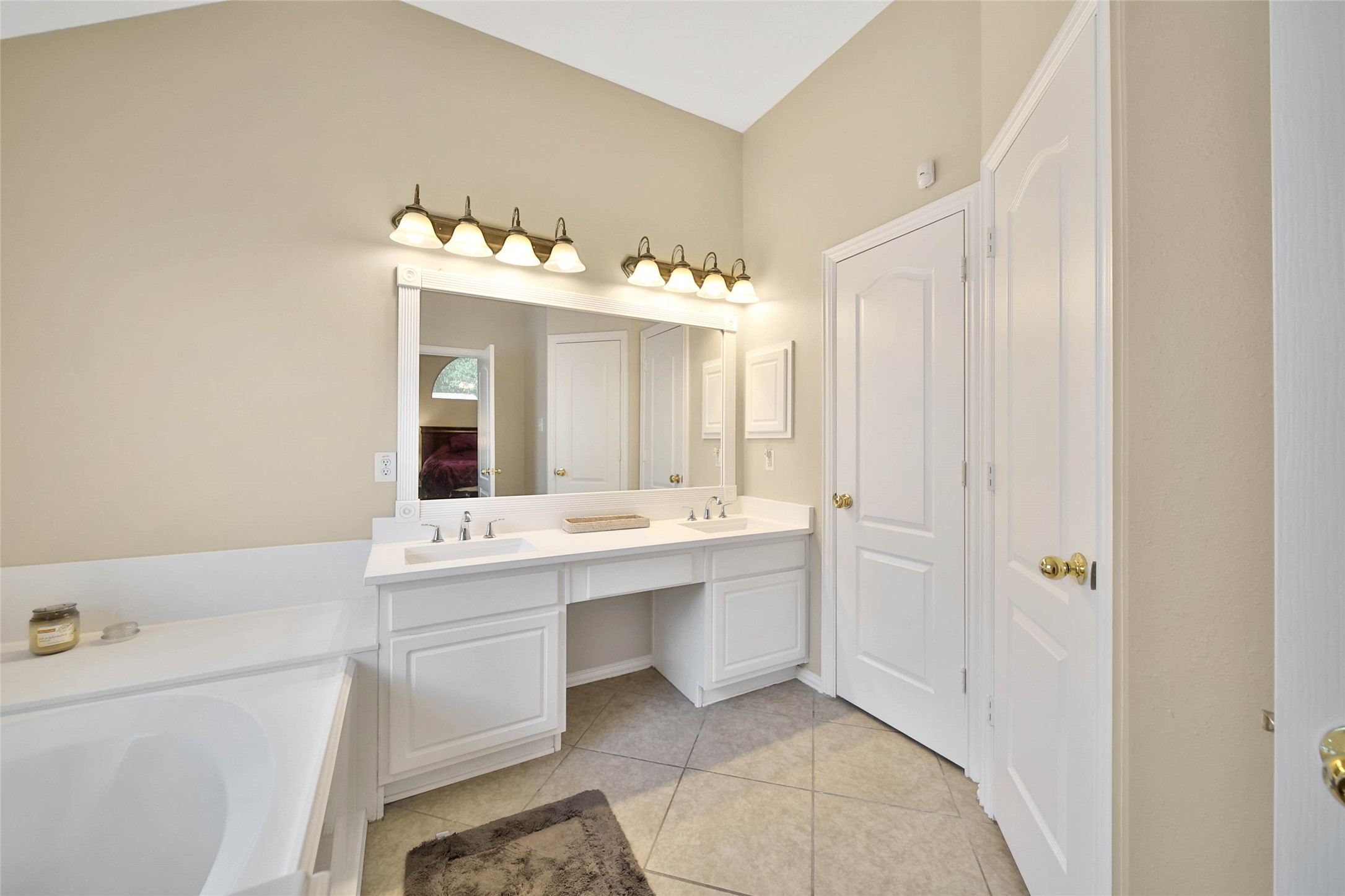 21338 Timber Pines Drive Spring, TX 77388 - Photo 20 of 29 a bathroom with a sink mirror and a bathtub