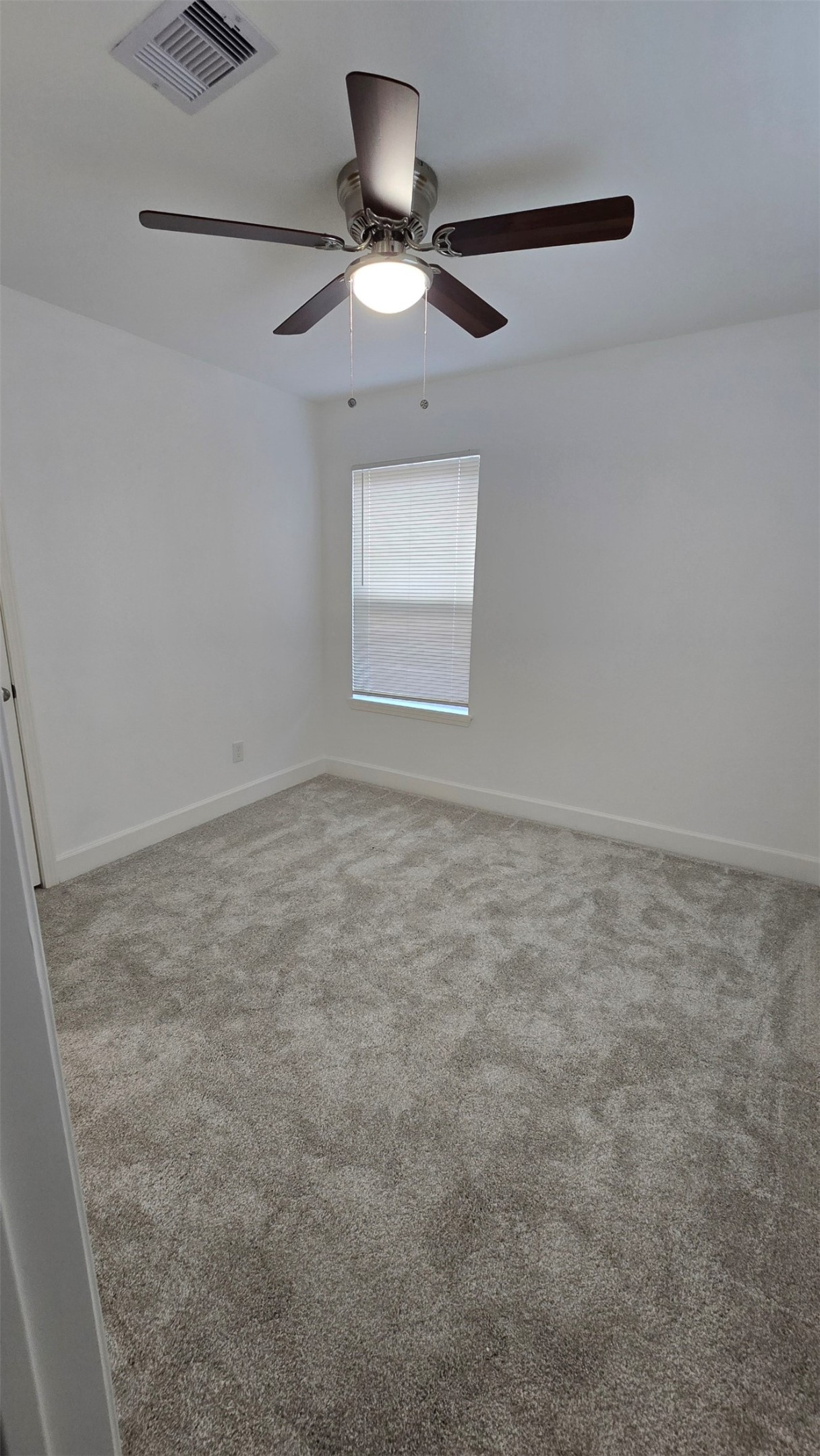 5122 Myrtlewood Street Houston, TX 77033 - Photo 18 of 20 an empty room with a window