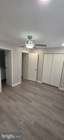 a view of a livingroom with wooden floor