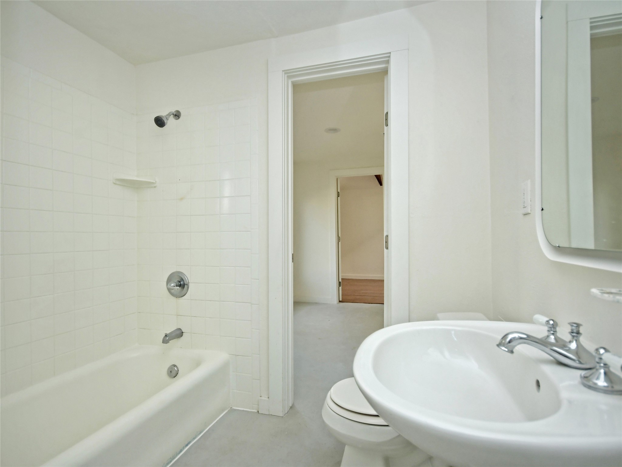 4604 Red River Street, Unit B Austin, TX 78751 - Photo 13 of 15 A well-maintained bathroom with a classic tub and shower combination.