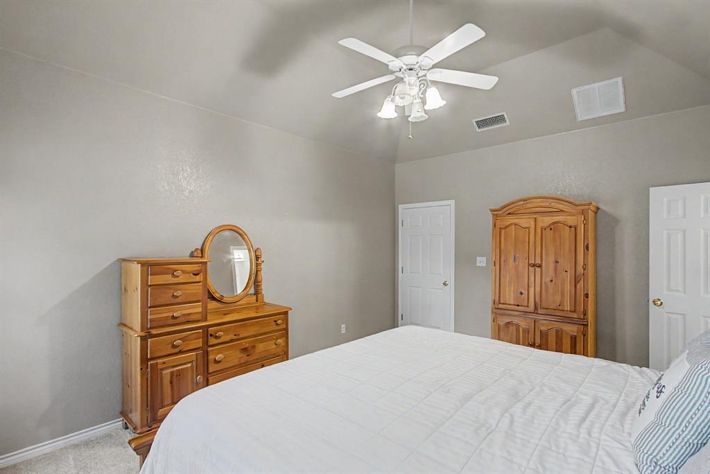 483 Christy Kay Lane Rhome, TX 76078 - Photo 19 of 40 a bedroom with a bed and dresser