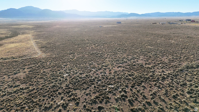 4855 Peakview Road Panguitch, UT 84759 - Photo 9 of 33 Aerial view of sparsely populated area with a mountainous background and a desert landscape