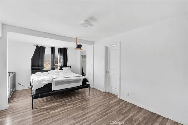 a bedroom with a bed and a view of bathroom